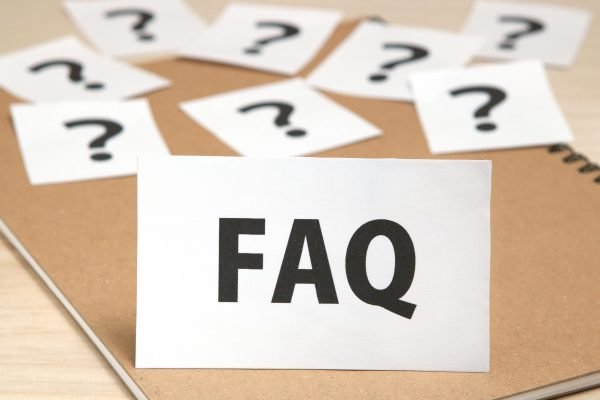 bigstock–189990109 FAQ on a piece of paper and many question marks on notebook.
FAQ or Frequently Asked Questions concept.
